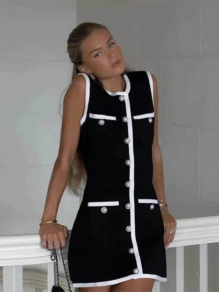 Nicole - Women's short black dress with pearl details and white trim - photo 2
