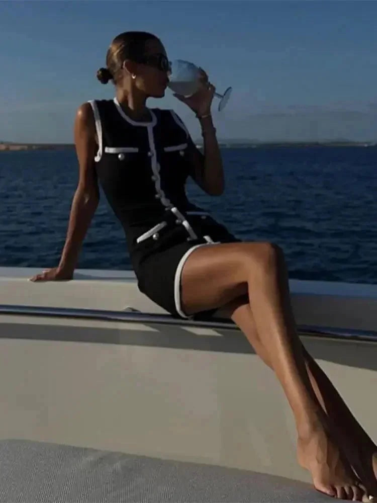 Nicole - Women's short black dress with pearl details and white trim - photo 5